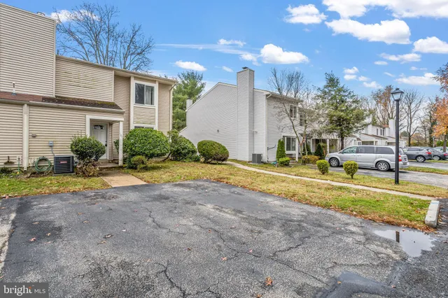 a view of a house with swimming pool and a yard