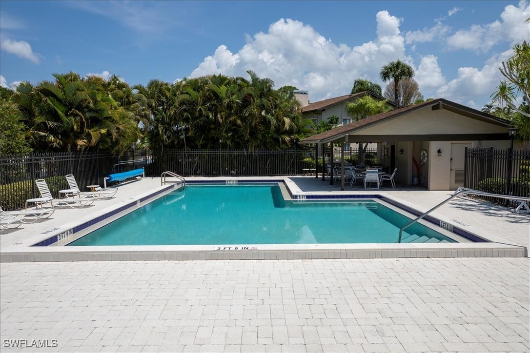 16620 Partridge Place Road, Unit 202 Fort Myers, FL 33908 - Photo 18 of 27 a view of a house with swimming pool and sitting area