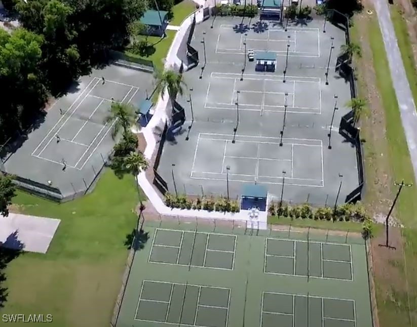 16620 Partridge Place Road, Unit 202 Fort Myers, FL 33908 - Photo 24 of 27 an aerial view of a house with a yard