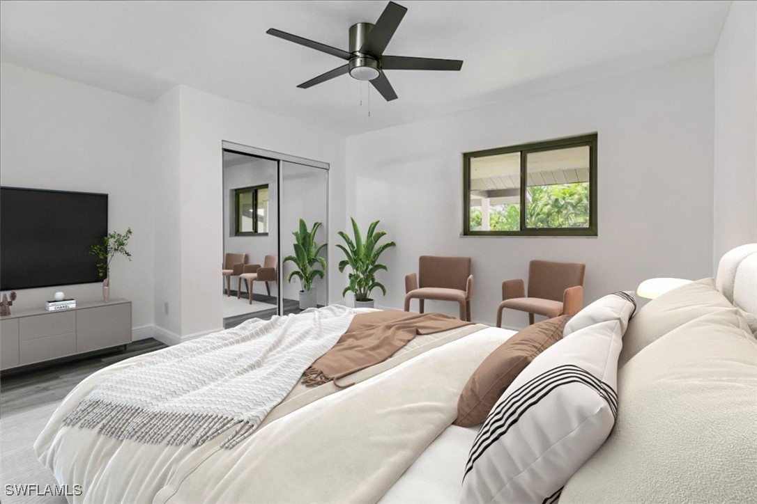 16620 Partridge Place Road, Unit 202 Fort Myers, FL 33908 - Photo 4 of 27 a bedroom with a bed and a flat screen tv