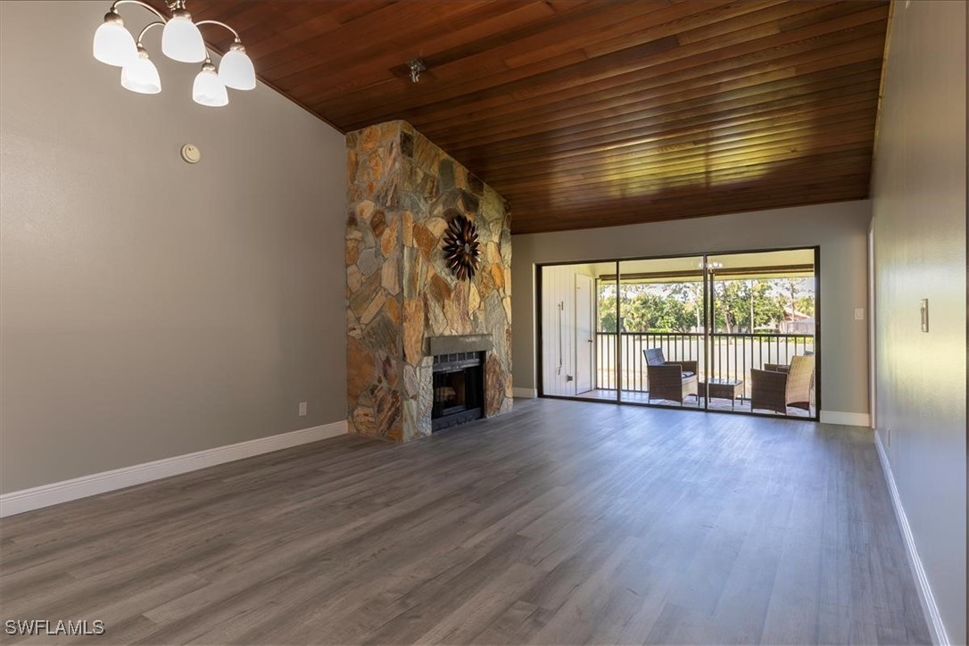 16620 Partridge Place Road, Unit 202 Fort Myers, FL 33908 - Photo 9 of 27 wooden floor in an empty room with a window