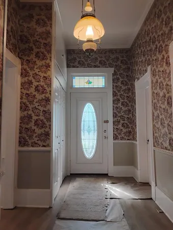 a view of a livingroom with wooden floor and a window