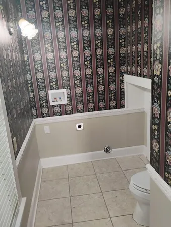 a view of bathroom with bathtub and shower