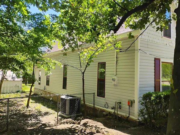 a backyard of a house with seating space