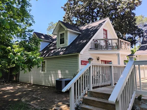 a view of a house with wooden stairs