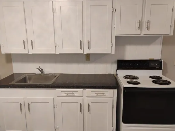 a kitchen with a sink and cabinets