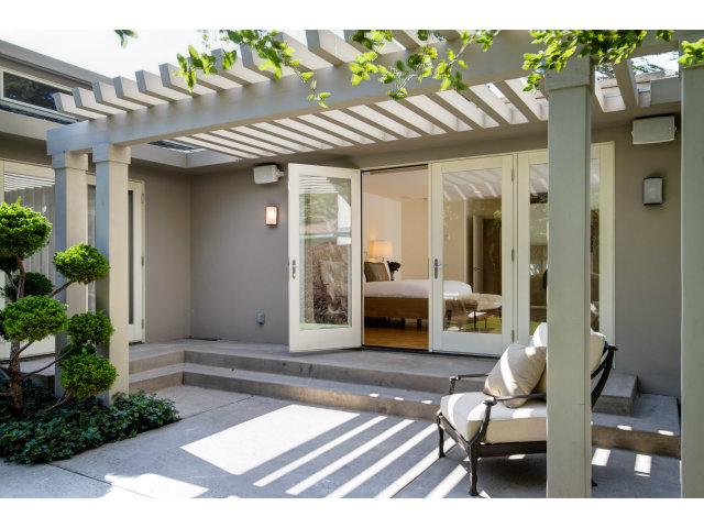 1021 Ocean Road Pebble Beach, CA 93953 - Photo 11 of 25 a view of living room with patio furniture and potted plants