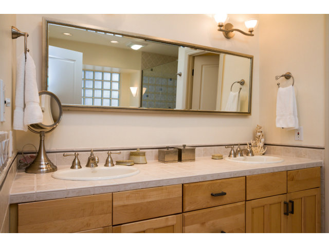 1021 Ocean Road Pebble Beach, CA 93953 - Photo 12 of 25 a bathroom with a sink and a mirror