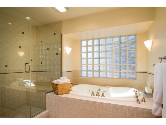 1021 Ocean Road Pebble Beach, CA 93953 - Photo 13 of 25 a bathroom with a bathtub and a shower