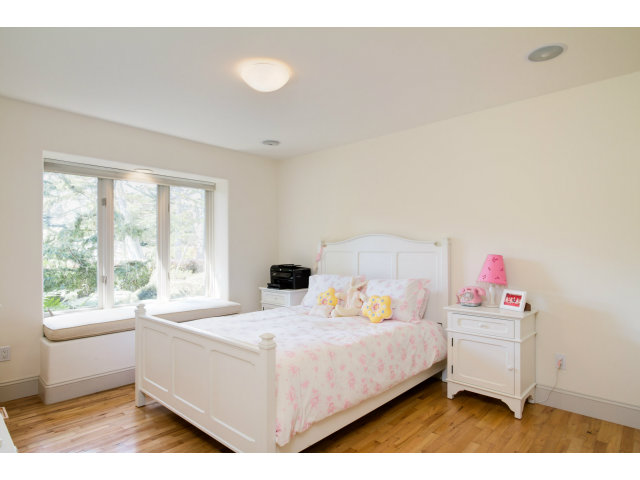 1021 Ocean Road Pebble Beach, CA 93953 - Photo 16 of 25 a bedroom with a bed and a large window