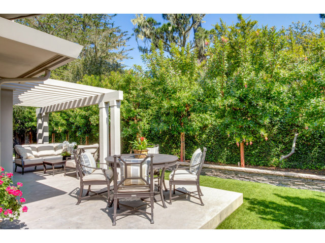 1021 Ocean Road Pebble Beach, CA 93953 - Photo 20 of 25 a view of a patio with a table chairs and a backyard