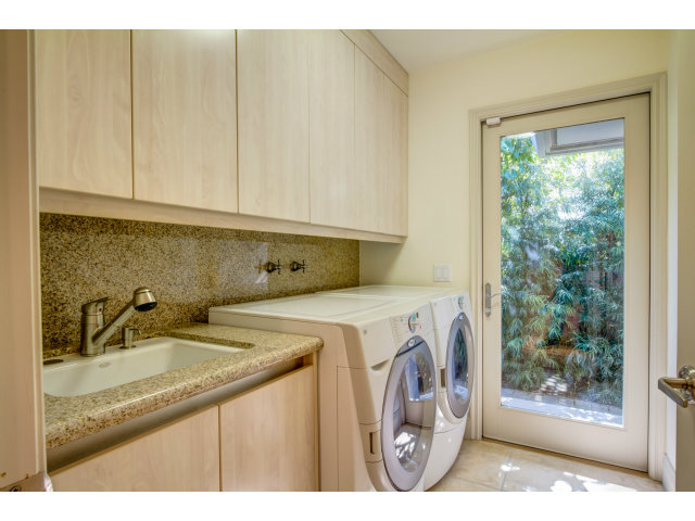 1021 Ocean Road Pebble Beach, CA 93953 - Photo 22 of 25 a utility room with dryer and washer