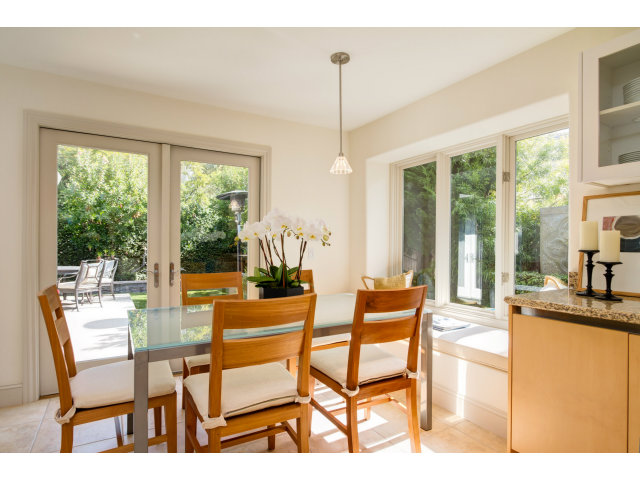 1021 Ocean Road Pebble Beach, CA 93953 - Photo 6 of 25 a dining room with furniture and large windows