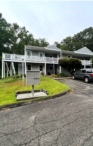 a view of swimming pool with outdoor seating and a yard