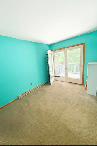 a view of an empty room with a window