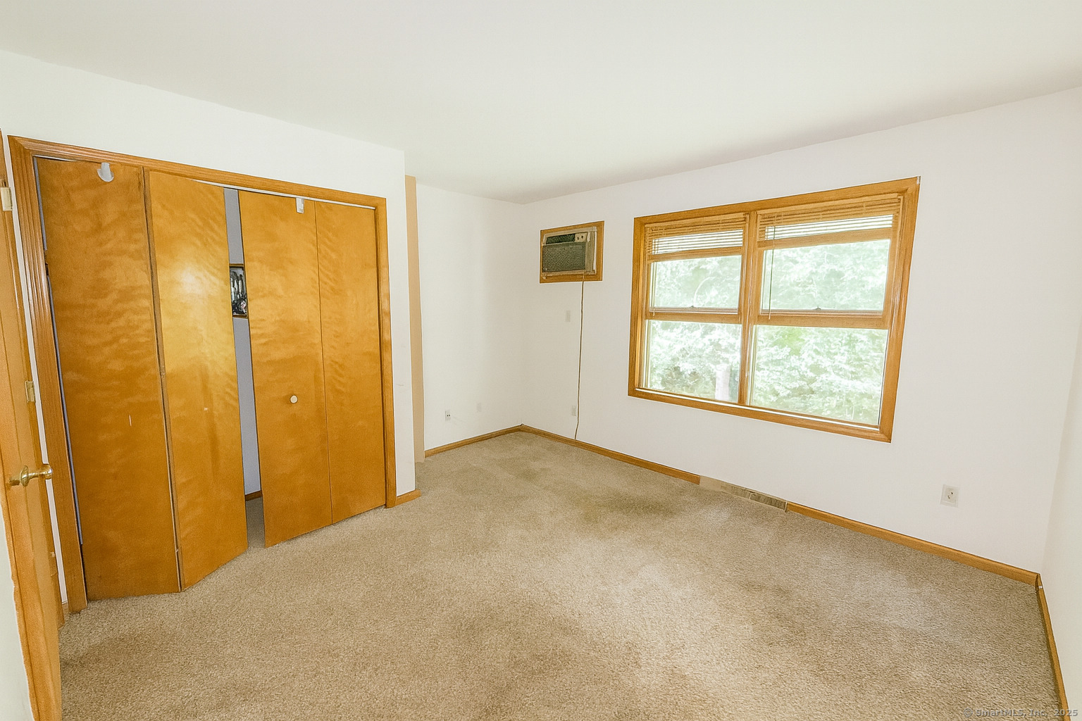 67 Hidden Knolls Circle, Unit 67 Monroe, CT 06468 - Photo 6 of 8 a view of an empty room with a window