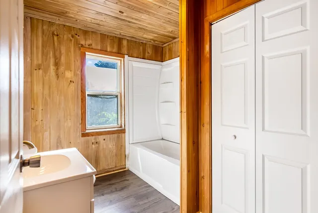 a bathroom with a tub and shower