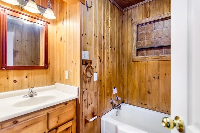 a bathroom with a bathtub and a sink
