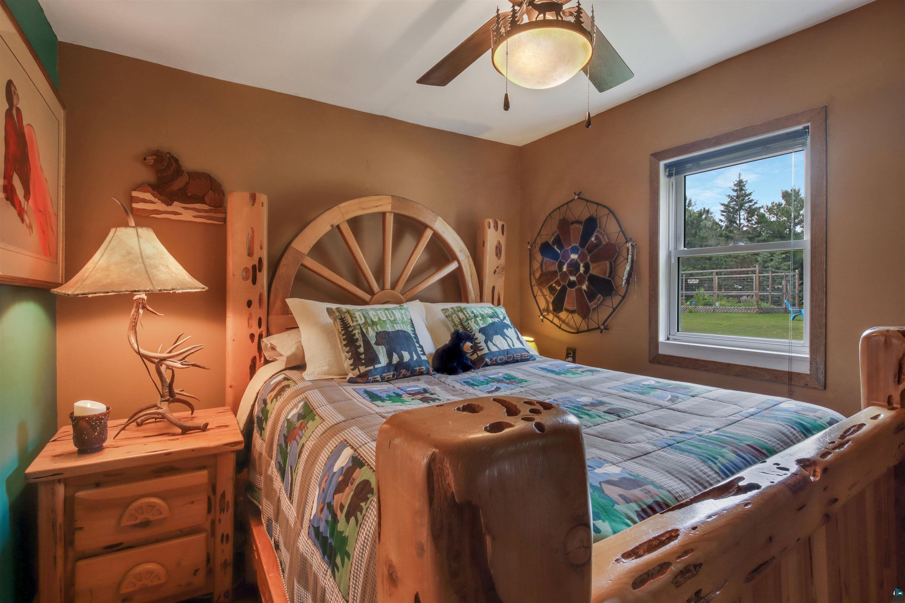 N8348 Island Lake Road Spooner, WI 54801 - Photo 21 of 40 Bedroom with ceiling fan