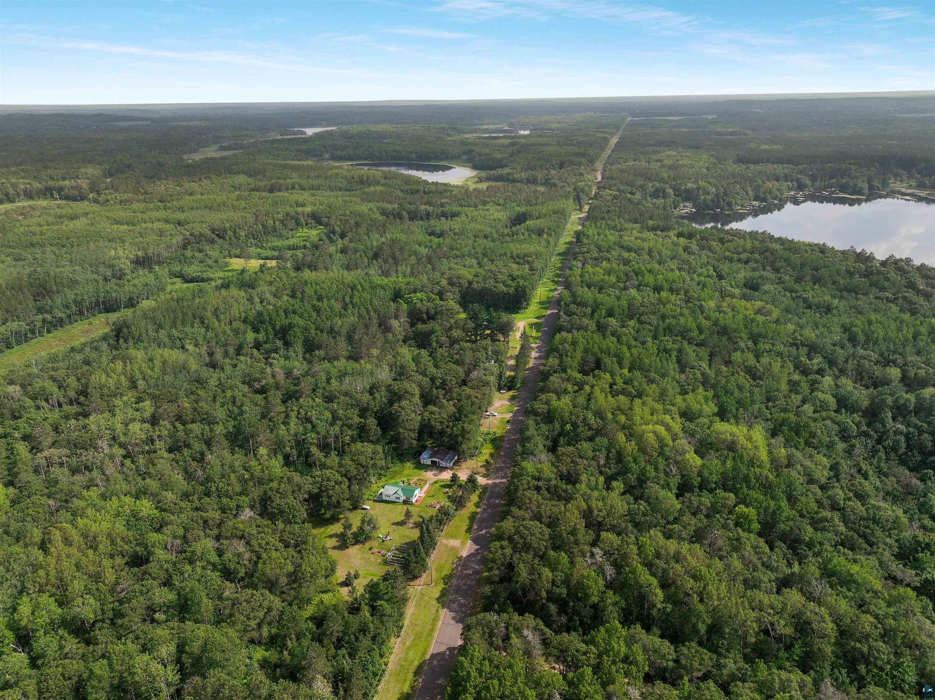 N8348 Island Lake Road Spooner, WI 54801 - Photo 40 of 40 Aerial view featuring a water view