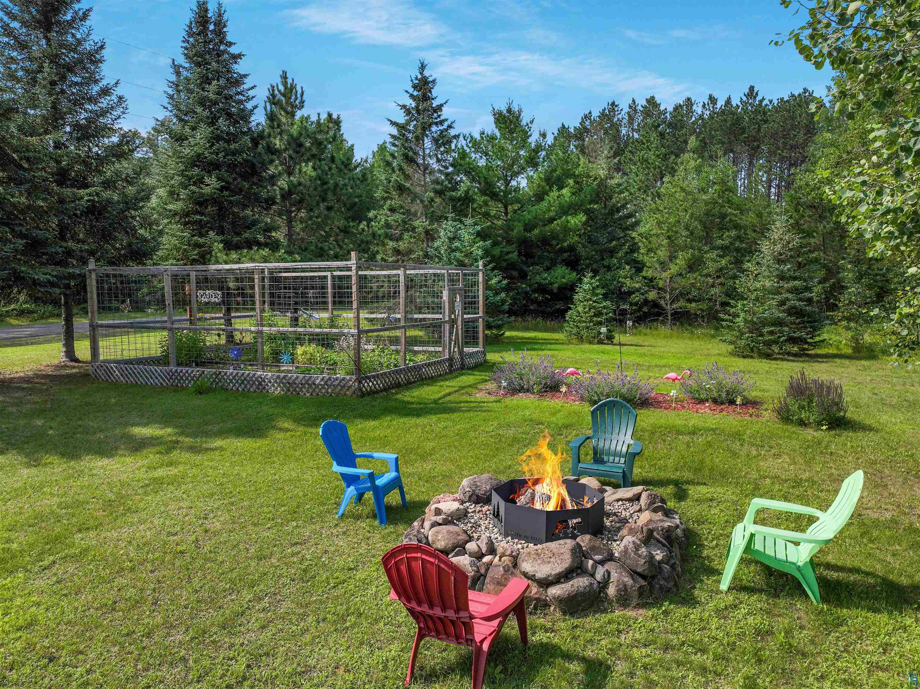 N8348 Island Lake Road Spooner, WI 54801 - Photo 5 of 40 View of yard featuring an outdoor fire pit