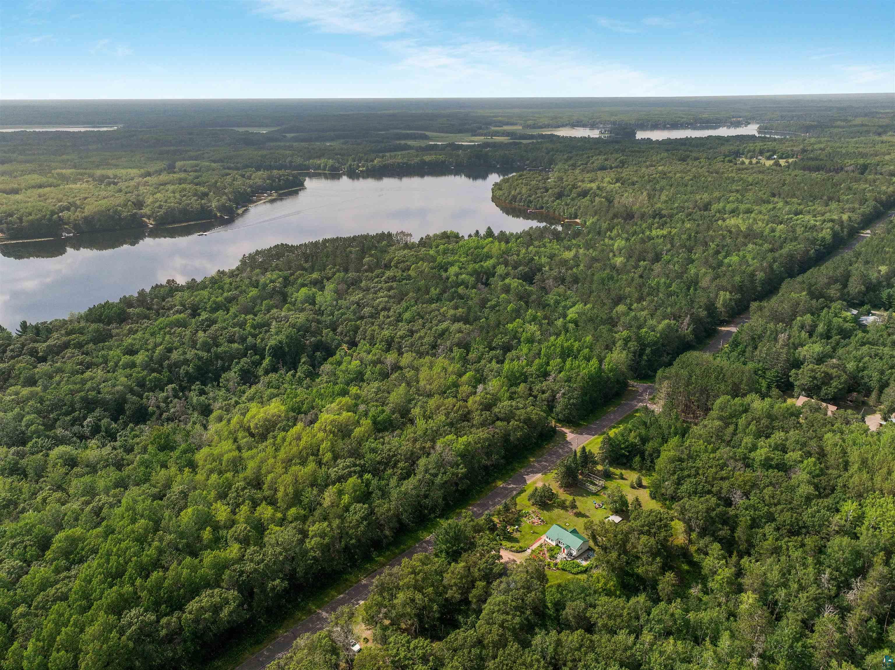 N8348 Island Lake Road Spooner, WI 54801 - Photo 7 of 40 Aerial view with a water view