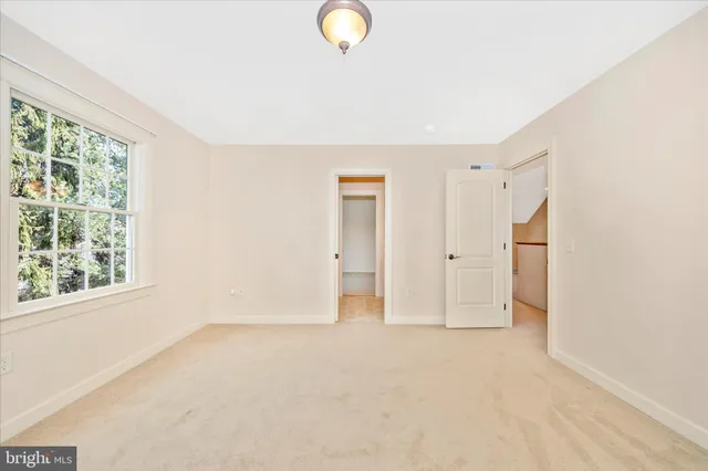 a view of an empty room with a garage