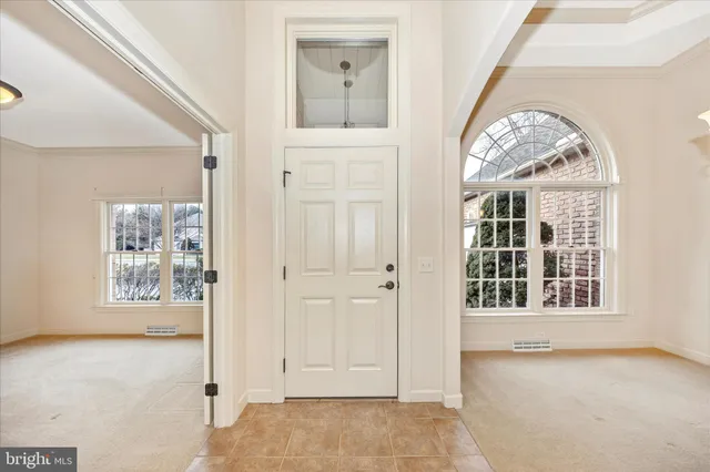 a view of a chandelier in big room and a chandelier