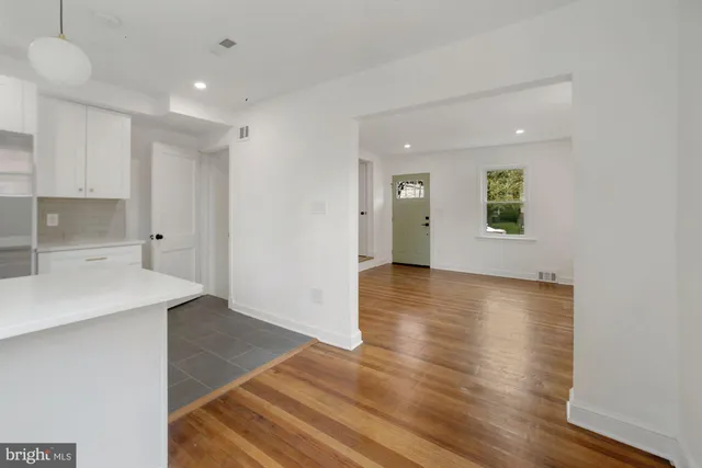 a view of a kitchen cabinets and wooden floor