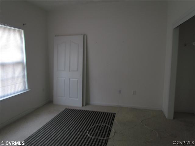 9337 Alcove Grove Road Chesterfield, VA 23832 - Photo 7 of 12 an empty room with windows