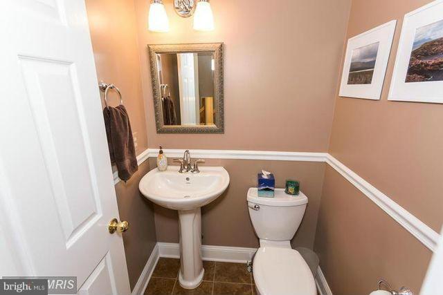 1500 Deer Point Way Reston, VA 20194 - Photo 15 of 26 a bathroom with a toilet sink and mirror