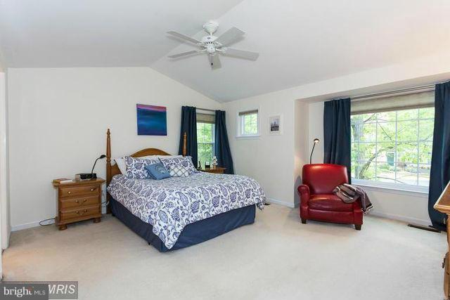 1500 Deer Point Way Reston, VA 20194 - Photo 17 of 26 a living room with a bed window and a couch