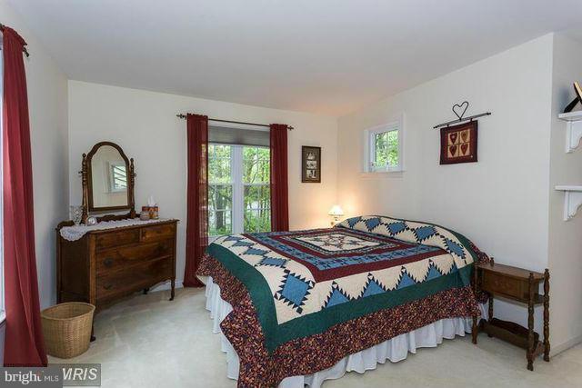 1500 Deer Point Way Reston, VA 20194 - Photo 18 of 26 a bedroom with a bed and a dresser