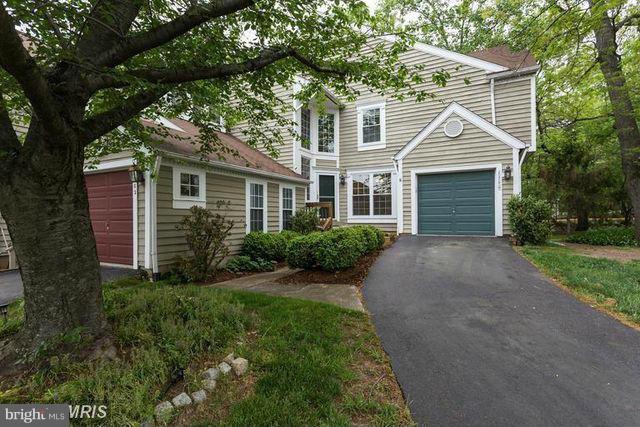 1500 Deer Point Way Reston, VA 20194 - Photo 4 of 26 a front view of a house with a yard and trees