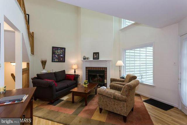 1500 Deer Point Way Reston, VA 20194 - Photo 9 of 26 a living room with furniture and a fireplace