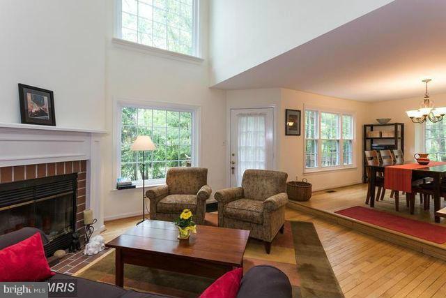 1500 Deer Point Way Reston, VA 20194 - Photo 10 of 26 a living room with furniture and a fireplace