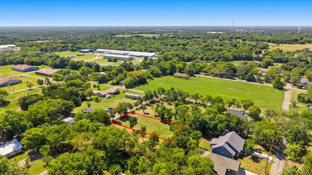 405 3rd Street Commerce, TX 75428 - Photo 21 of 26 Expansive lot featuring mature trees and open green space