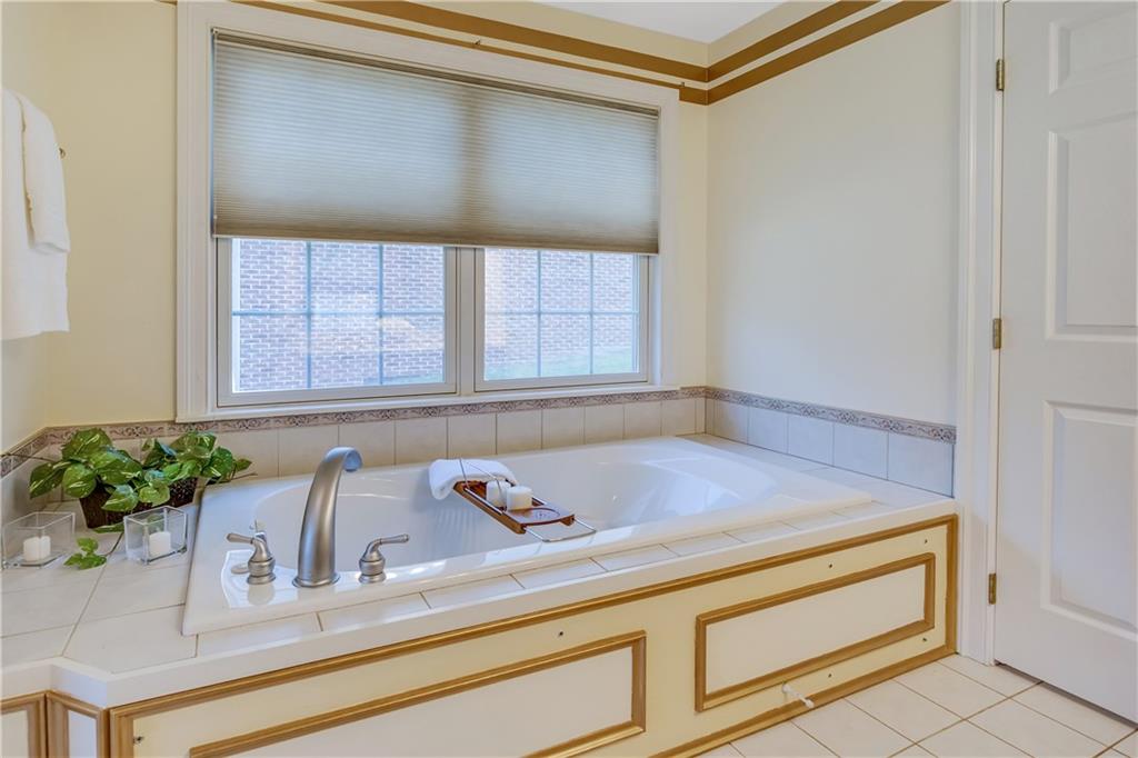 452 Sharon Road Coraopolis, PA 15108 - Photo 11 of 23 The master bath offers a jet spray tub with tile surround. A relaxing retreat.
