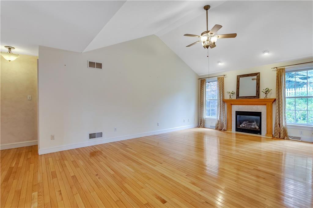 452 Sharon Road Coraopolis, PA 15108 - Photo 4 of 23 The living room offers a vaulted ceiling with a ceiling fan light. Large windows provide plenty of natural light.