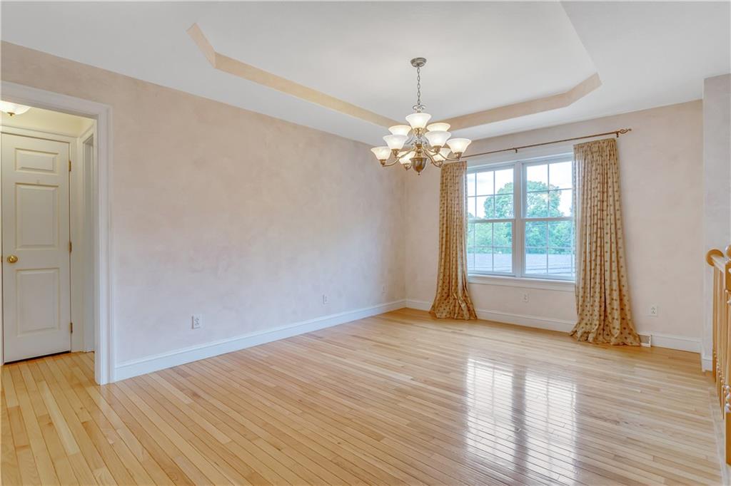 452 Sharon Road Coraopolis, PA 15108 - Photo 5 of 23 The dining room includes hardwood floors and a Trey ceiling with custom lighting.
