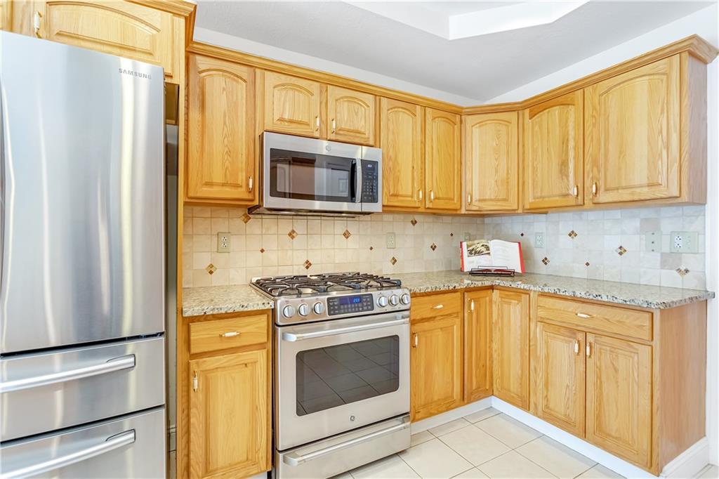 452 Sharon Road Coraopolis, PA 15108 - Photo 7 of 23 The kitchen offers plenty of counter space and cabinetry.