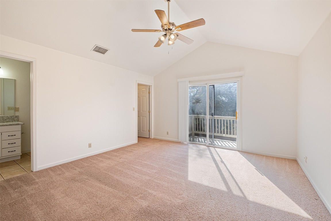 1003 Canyon Edge Drive, Unit B Austin, TX 78733 - Photo 13 of 25 an empty room with chandelier fan