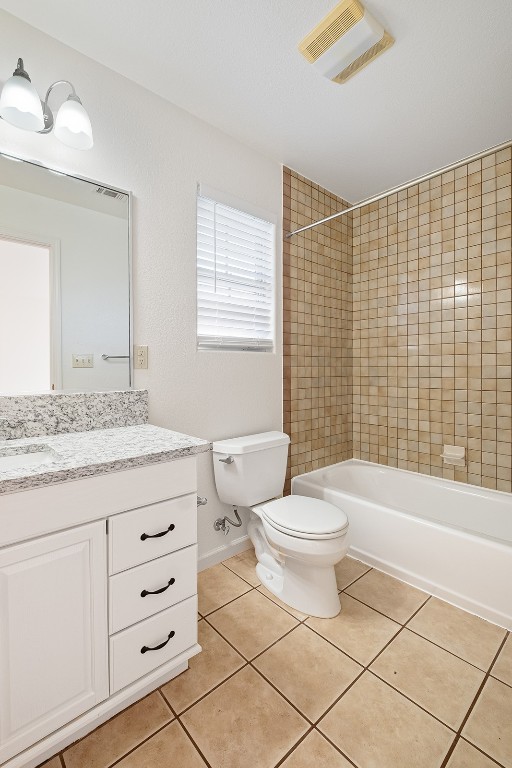 1003 Canyon Edge Drive, Unit B Austin, TX 78733 - Photo 15 of 25 a bathroom with a granite countertop toilet a sink and a bathtub