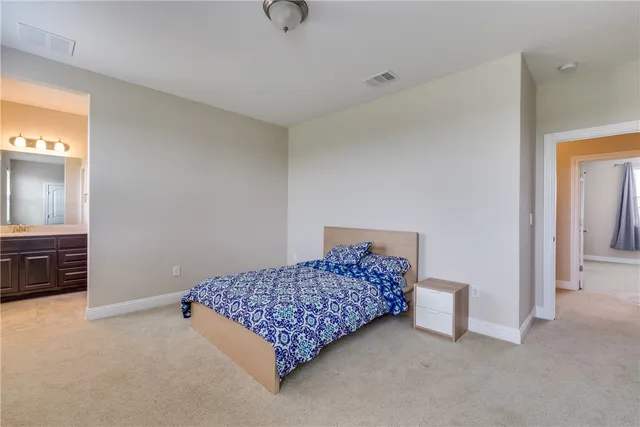 a room with a bed and a cabinets