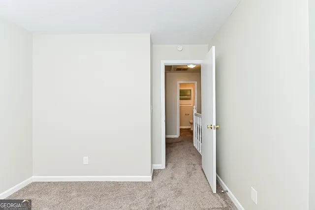 a view of a hallway with a room