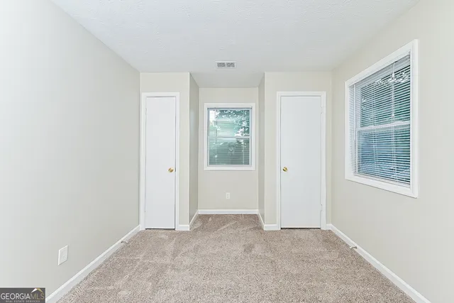 an empty room with windows