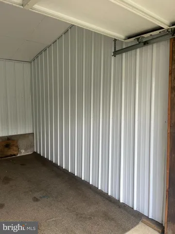 a view of a room with a wooden floor