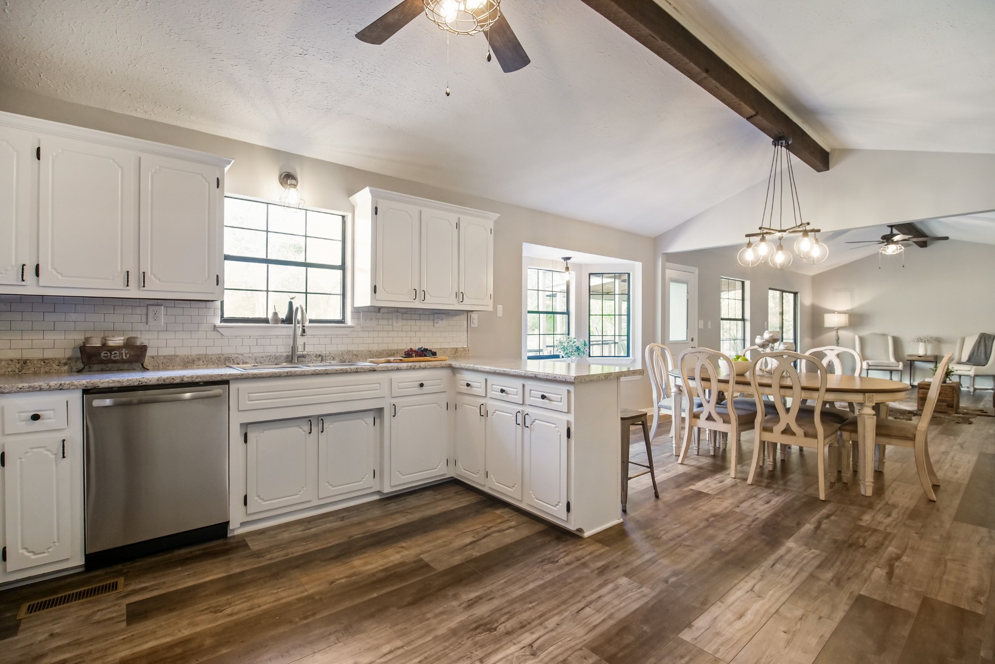 3977 Cairo Bend Road Lebanon, TN 37087 - Photo 2 of 39 a kitchen with sink cabinets and dining table