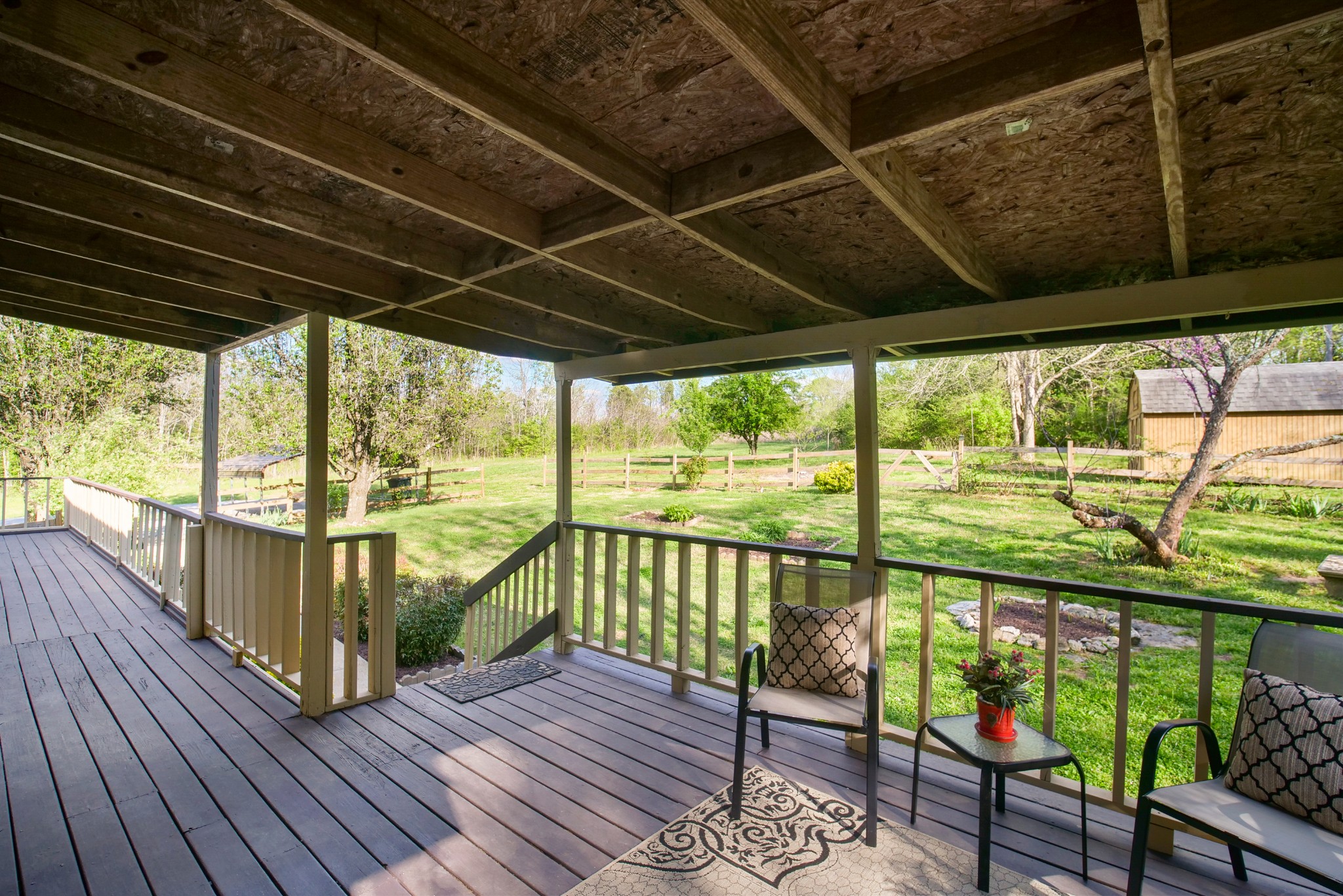 3977 Cairo Bend Road Lebanon, TN 37087 - Photo 11 of 39 a view of a balcony with chairs and wooden floor
