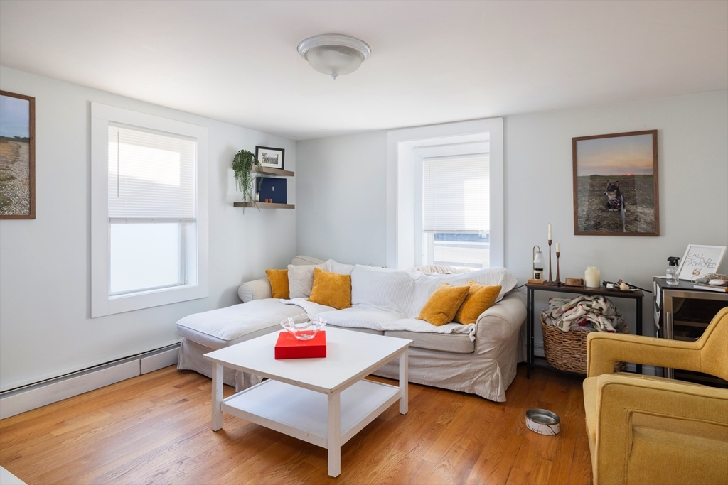 140 Athens Street Boston, MA 02127 - Photo 6 of 11 a living room with furniture and a window
